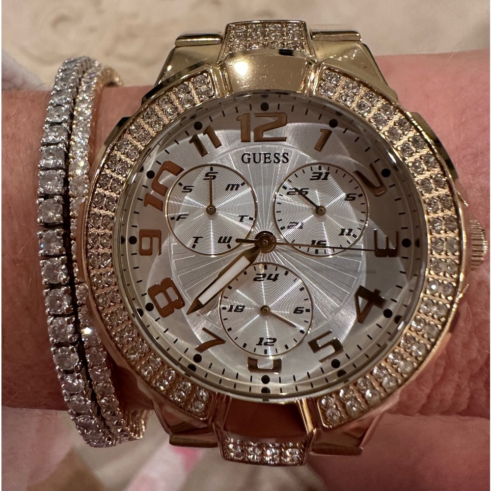 GUESS ladies stainless steel/ gold toned, multifunction watch.